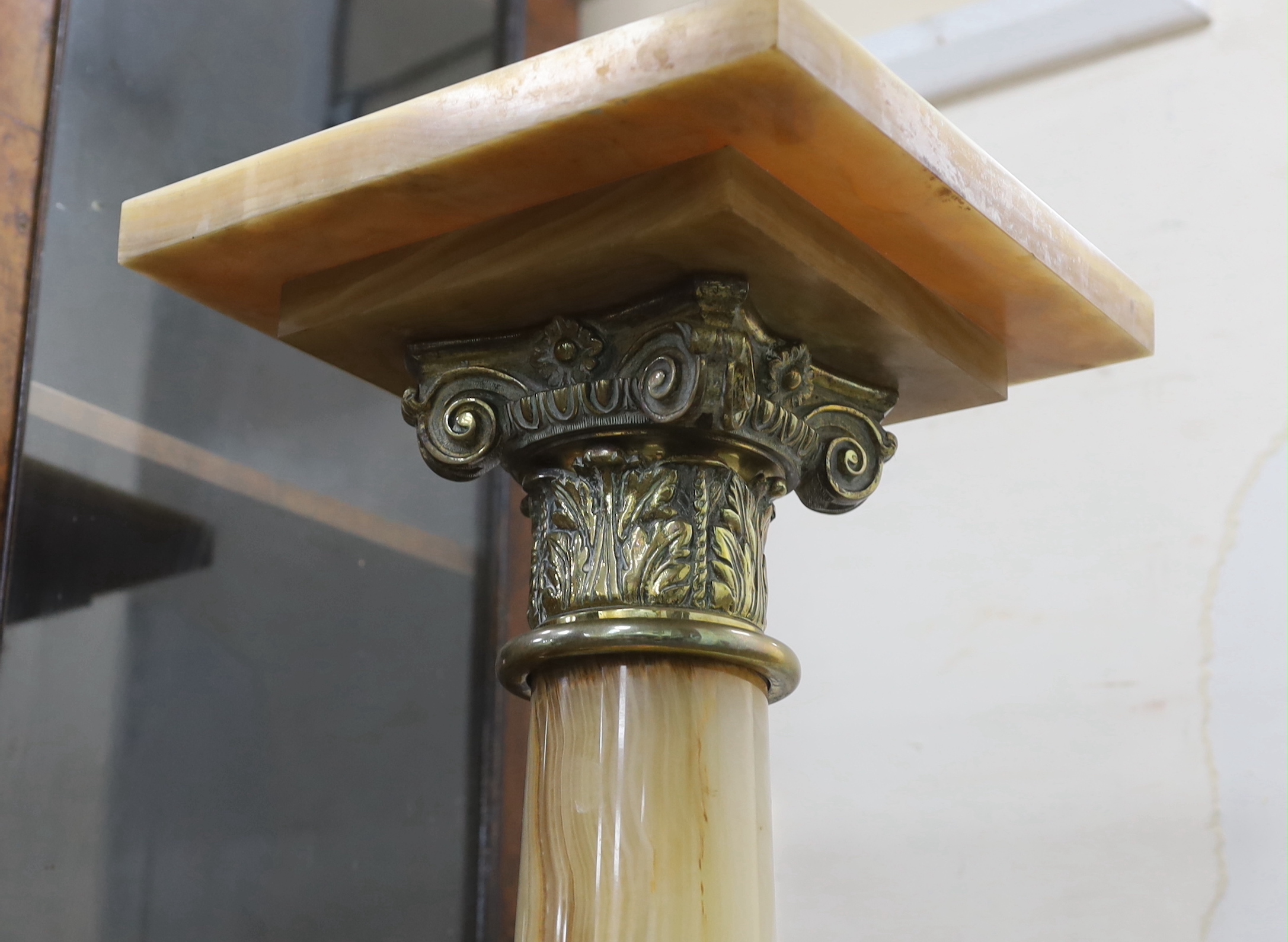 A gilt metal mounted and onyx pedestal, width 25cm, height 103cm